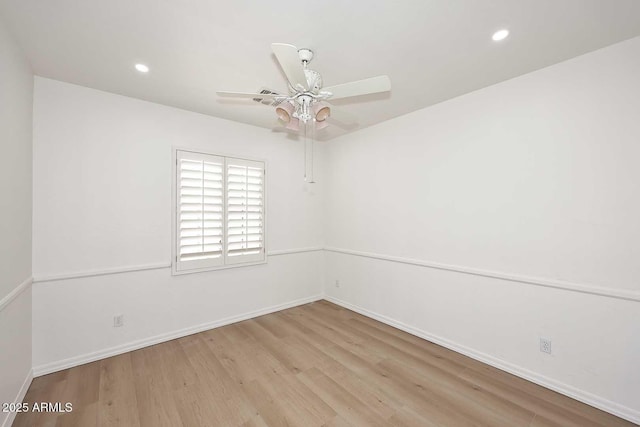 3931 E Crest Ln, Phoenix, AZ 85050 - spare room featuring a ceiling fan, wood finished floors, baseboards, and recessed lighting