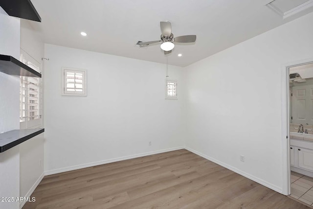 3931 E Crest Ln, Phoenix, AZ 85050 - unfurnished dining area with a ceiling fan, light wood finished floors, a sink, recessed lighting, and baseboards