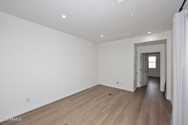 3931 E Crest Ln, Phoenix, AZ 85050 - empty room with light wood-type flooring, recessed lighting, and baseboards