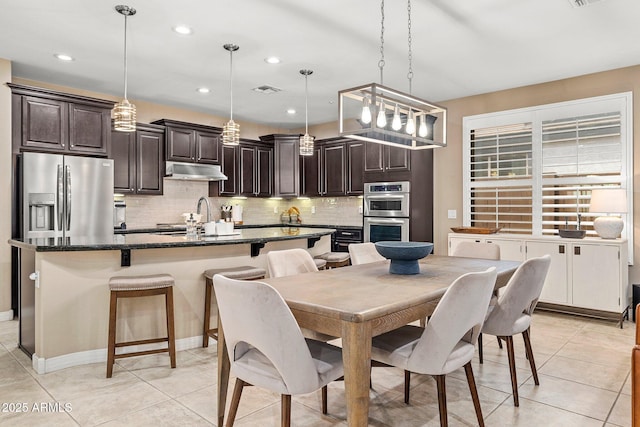 dining room featuring recessed lighting, light tile patterned floors, and visible vents