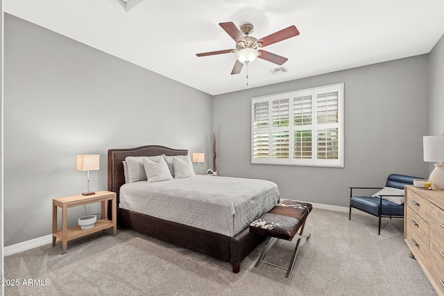 carpeted bedroom featuring visible vents, baseboards, and ceiling fan