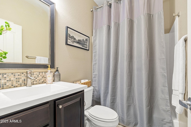 bathroom with shower / bathtub combination with curtain, vanity, toilet, and decorative backsplash