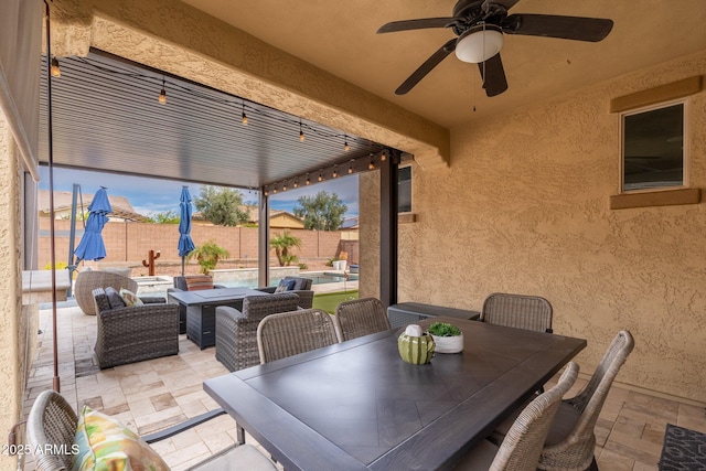 view of patio / terrace with an outdoor living space, ceiling fan, a fenced backyard, outdoor dining space, and a fenced in pool