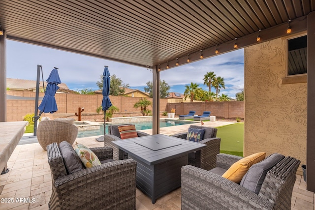 view of patio / terrace with a fenced backyard and a fenced in pool