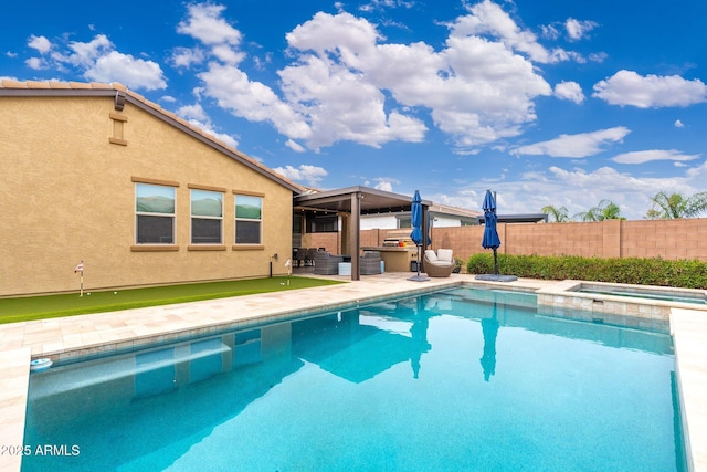 view of pool featuring a patio area, a fenced in pool, fence, and an in ground hot tub