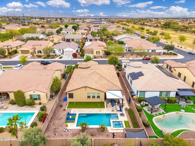 bird's eye view featuring a residential view and a mountain view
