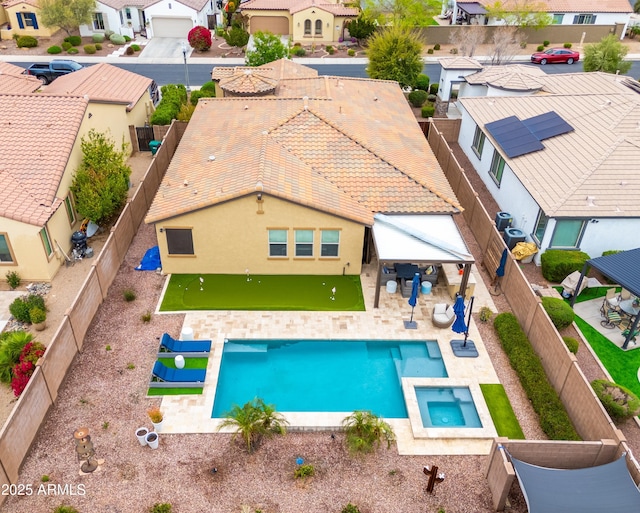 view of pool with a fenced backyard, a patio, an in ground hot tub, a fenced in pool, and a residential view