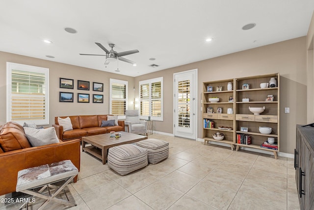 living area with baseboards, recessed lighting, a ceiling fan, light tile patterned flooring, and visible vents