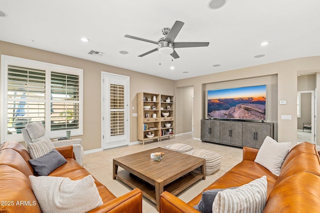 living area with visible vents, baseboards, light tile patterned floors, a ceiling fan, and recessed lighting
