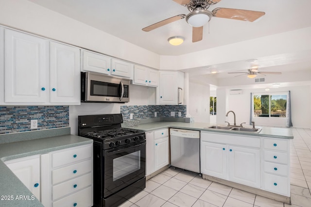 kitchen with a sink, dishwasher, a peninsula, stainless steel microwave, and black gas range