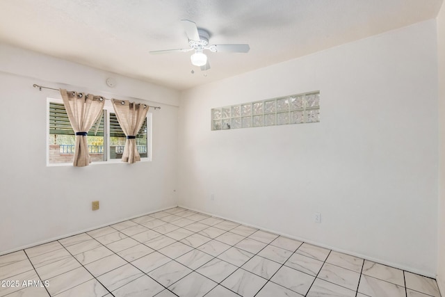 unfurnished room featuring ceiling fan
