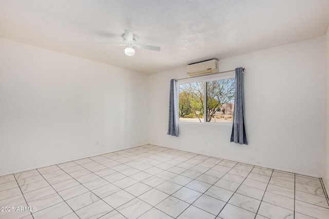 empty room with ceiling fan and a wall mounted AC