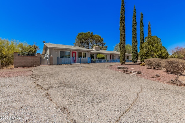single story home with fence private yard and a gate