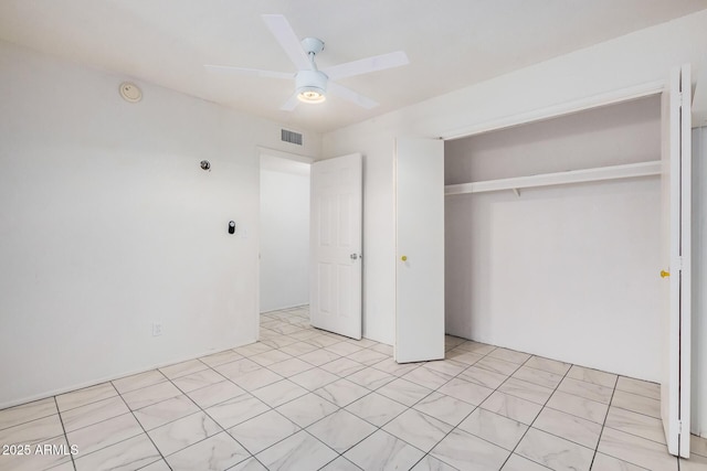 unfurnished bedroom with ceiling fan, a closet, and visible vents