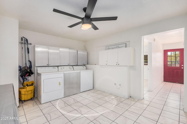 laundry room featuring a ceiling fan, cabinet space, and washer and dryer
