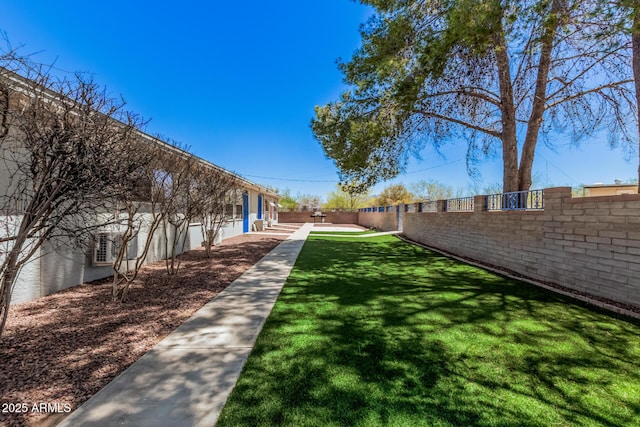 surrounding community with a lawn and fence