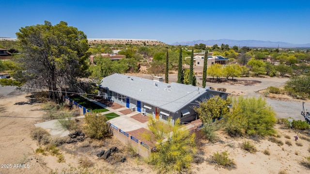 birds eye view of property with a mountain view