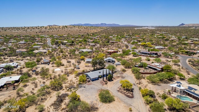aerial view featuring a mountain view and view of desert