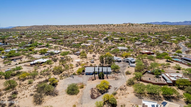drone / aerial view with a mountain view and view of desert