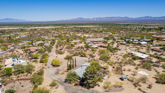aerial view featuring a mountain view and view of desert