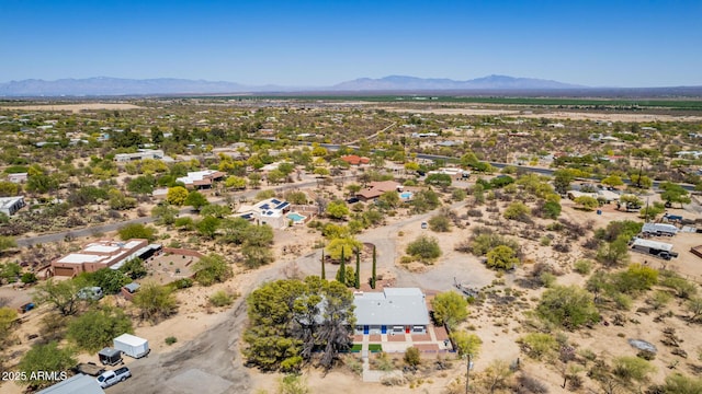 birds eye view of property featuring a mountain view and view of desert