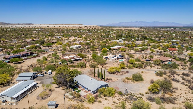 bird's eye view with view of desert and a mountain view