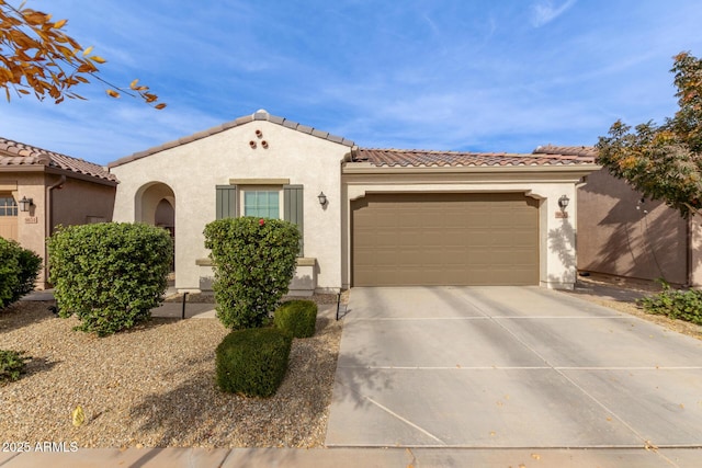 mediterranean / spanish house featuring a garage