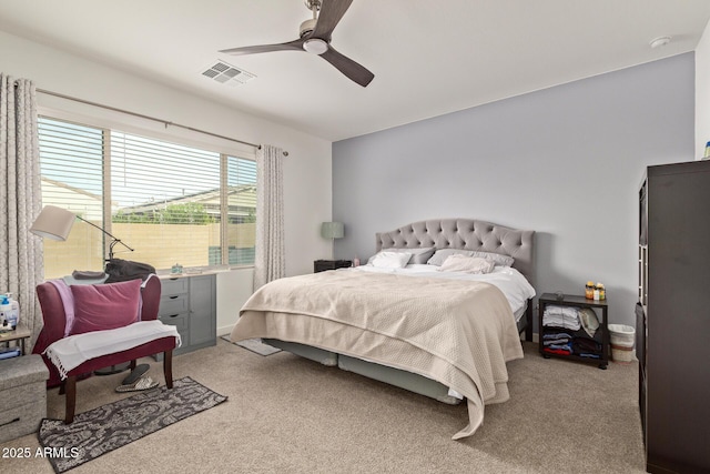 bedroom featuring ceiling fan and light carpet