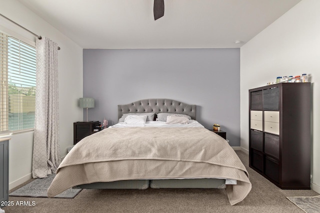 bedroom featuring ceiling fan and light colored carpet