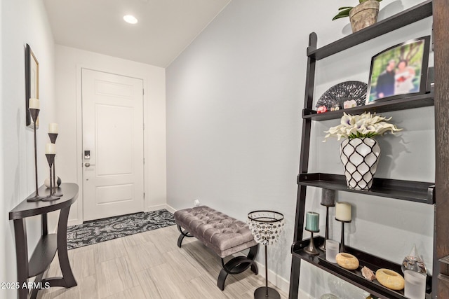 entryway featuring lofted ceiling