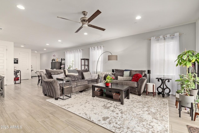 living room featuring ceiling fan