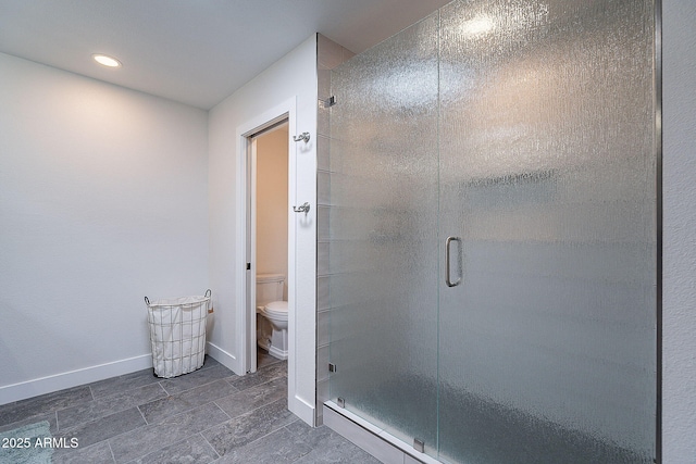 full bathroom with toilet, tile patterned floors, recessed lighting, baseboards, and a shower stall