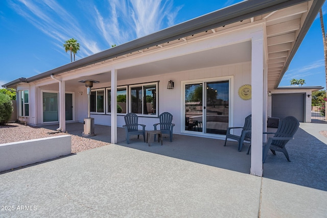 back of house with a patio