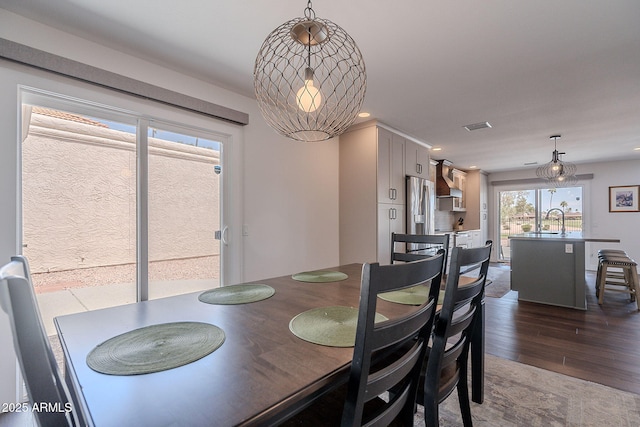 dining room featuring visible vents, recessed lighting, and dark wood-style flooring