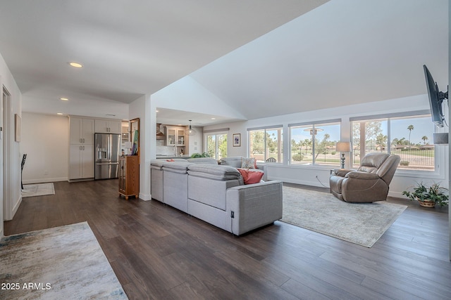 living room featuring recessed lighting, baseboards, and dark wood-style floors
