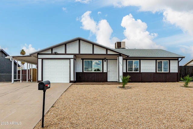 view of front facade featuring a garage and a carport