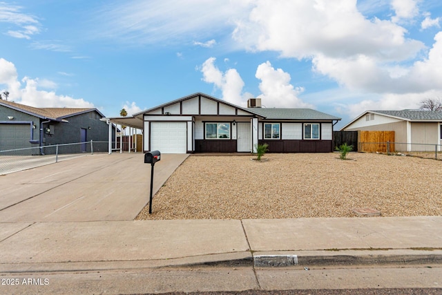 view of front facade with a garage and a carport