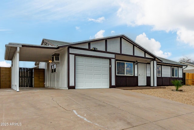 view of front of property with a garage and a carport