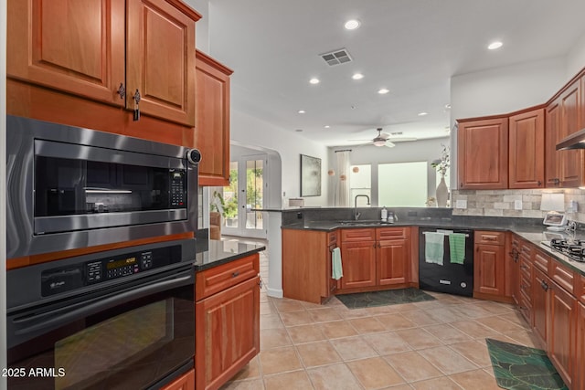 kitchen featuring appliances with stainless steel finishes, tasteful backsplash, ceiling fan, sink, and light tile patterned floors