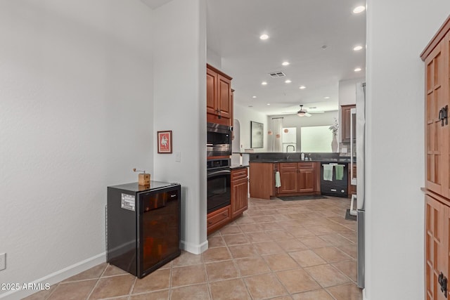 kitchen with ceiling fan, sink, light tile patterned floors, and black appliances