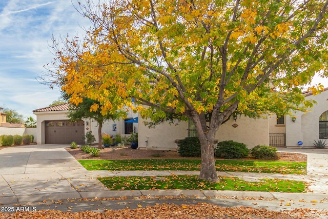 obstructed view of property with a garage