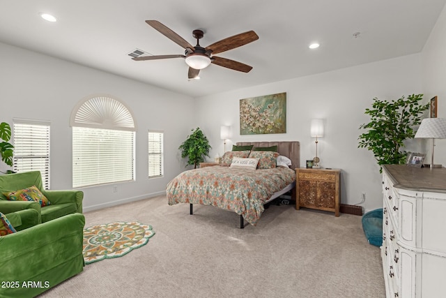 bedroom with ceiling fan and light colored carpet