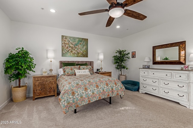 bedroom featuring ceiling fan and light colored carpet