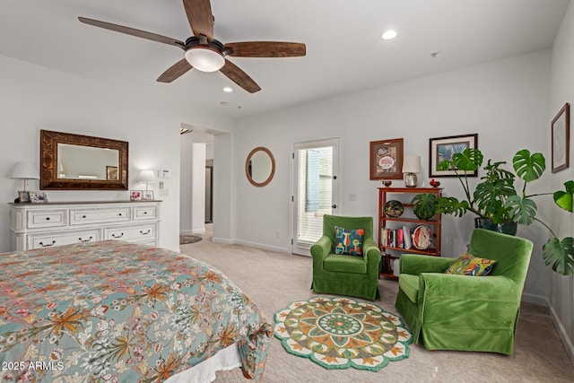 bedroom featuring light colored carpet and ceiling fan