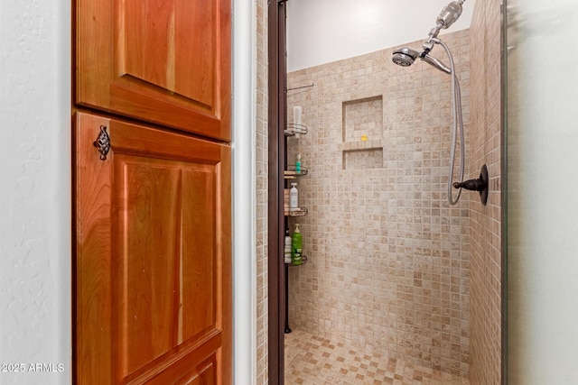 bathroom featuring a shower with shower door