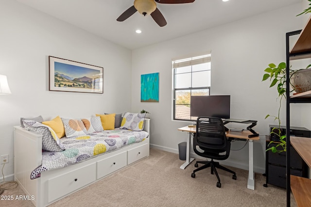 office featuring light carpet and ceiling fan