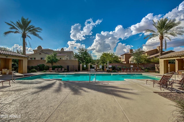 view of swimming pool featuring a patio area