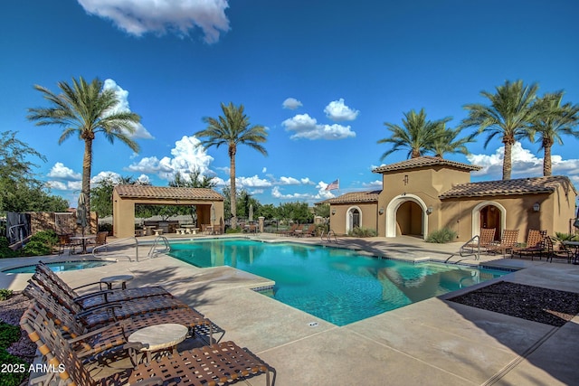 view of swimming pool with a patio