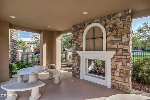 view of patio / terrace with an outdoor stone fireplace