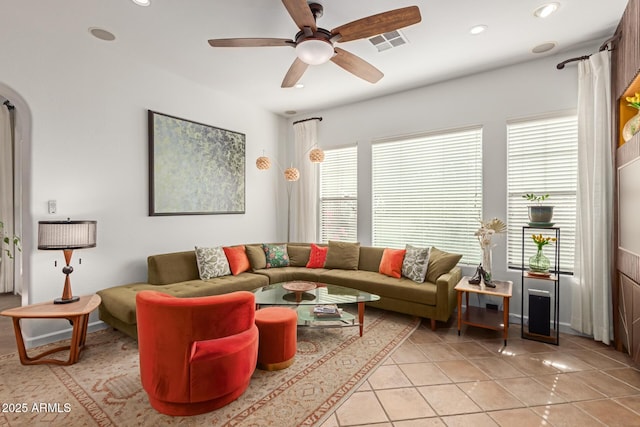 tiled living room featuring ceiling fan